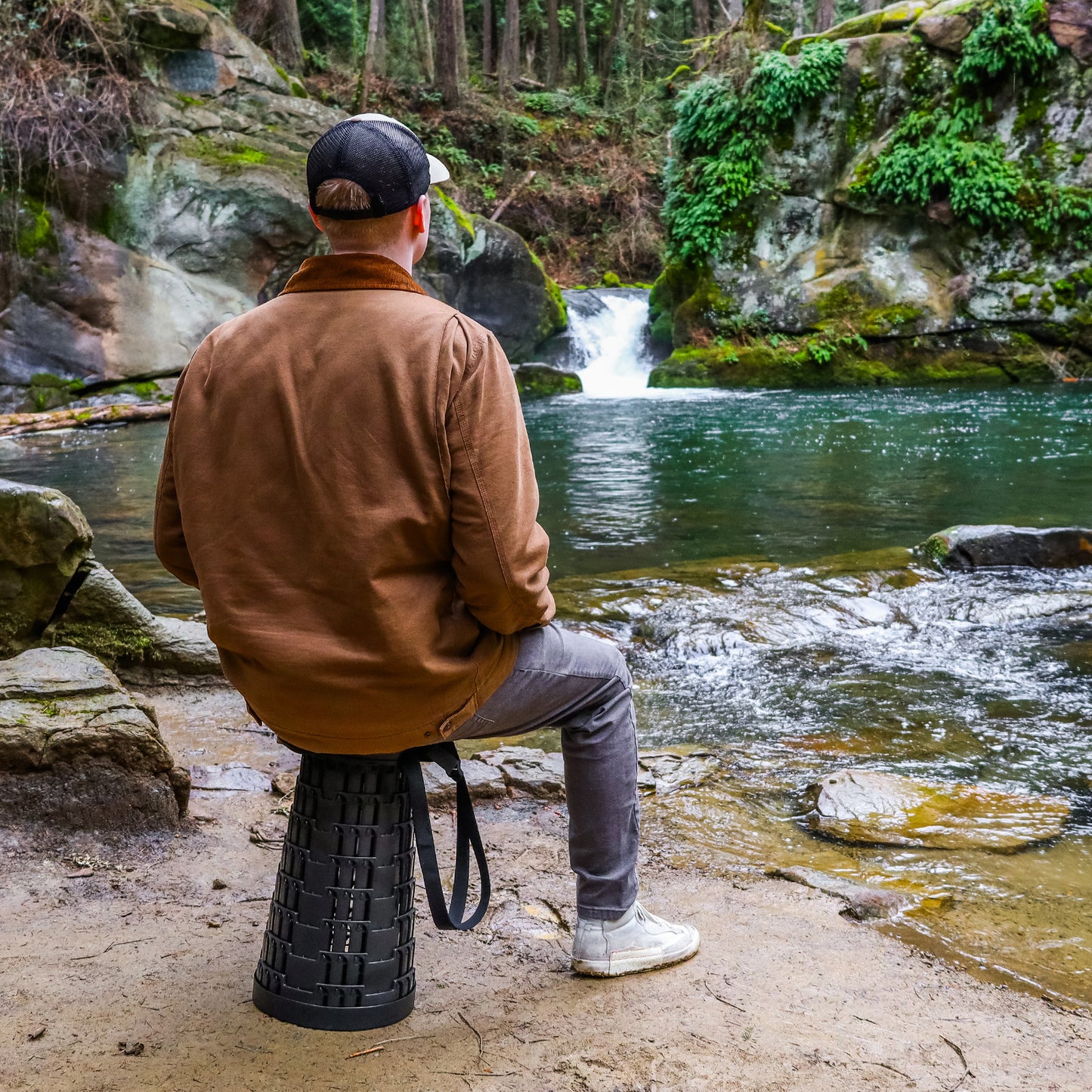 Collapsible Stool outdoors by a river or waterfall scenic view
