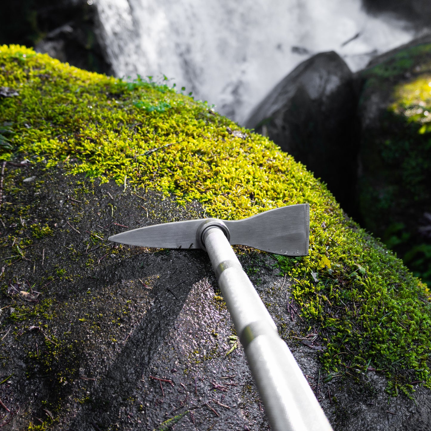 climbing pickaxe at the top of a waterfall