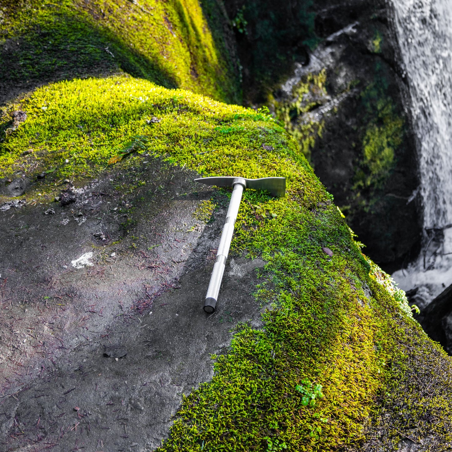 climbing pickaxe at the top of a waterfall
