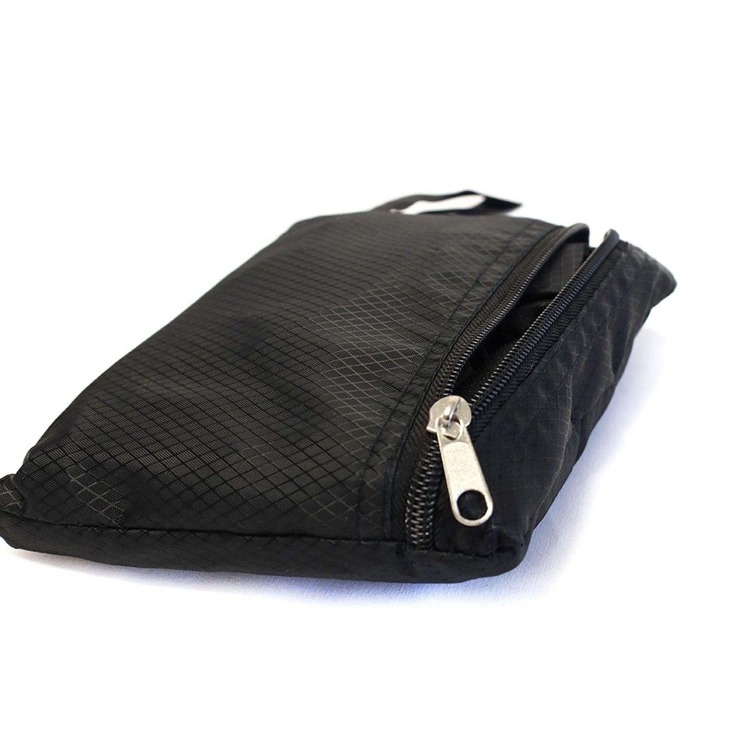 collapsible all black backpack transforms from as small as a pencil pouch to a medium sized backpack