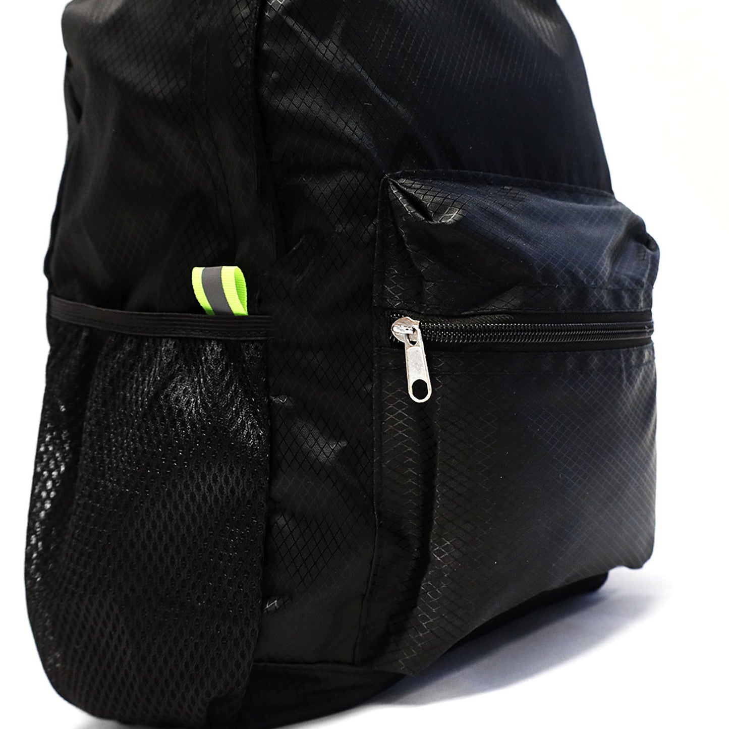 collapsible all black backpack transforms from as small as a pencil pouch to a medium sized backpack