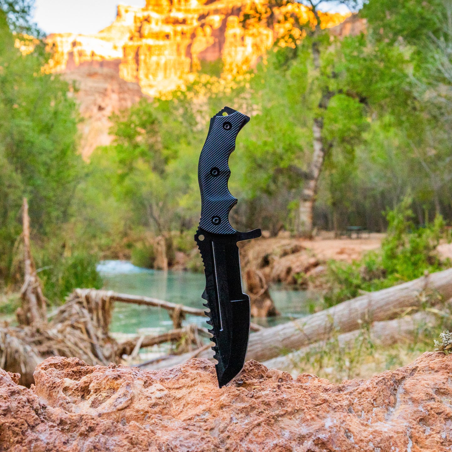 scenic view of tactical huntsman knife in grand canyon by a river