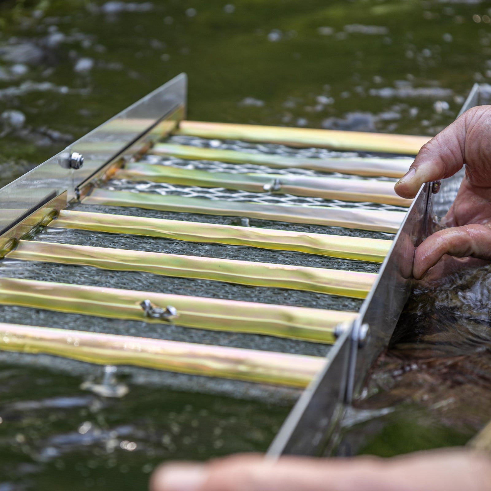 metal riffles in a sluice box