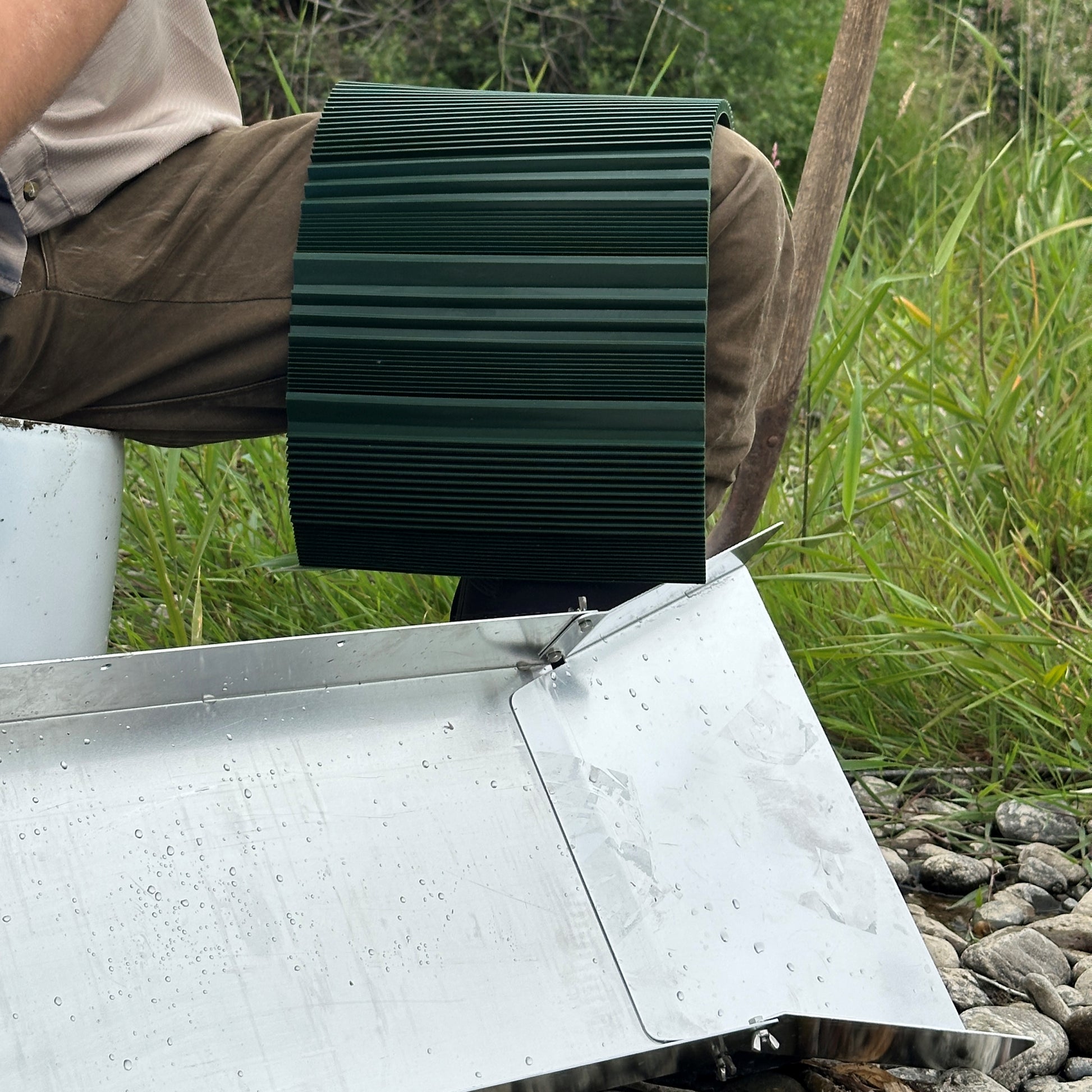 cleaning riffled sluice mat for gold panning