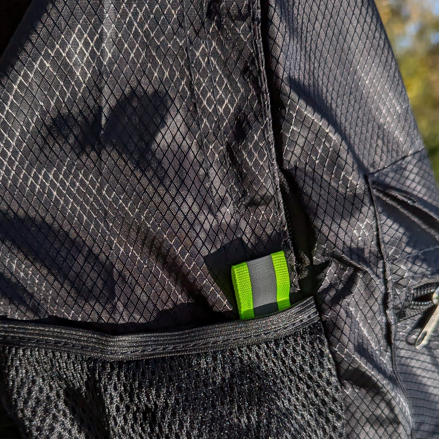 collapsible all black backpack transforms from as small as a pencil pouch to a medium sized backpack
