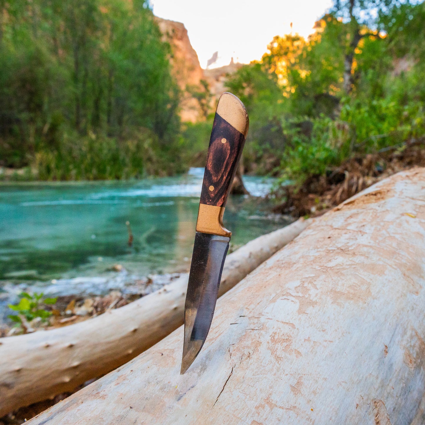 mini huntsman knife scenic view blue river in the desert