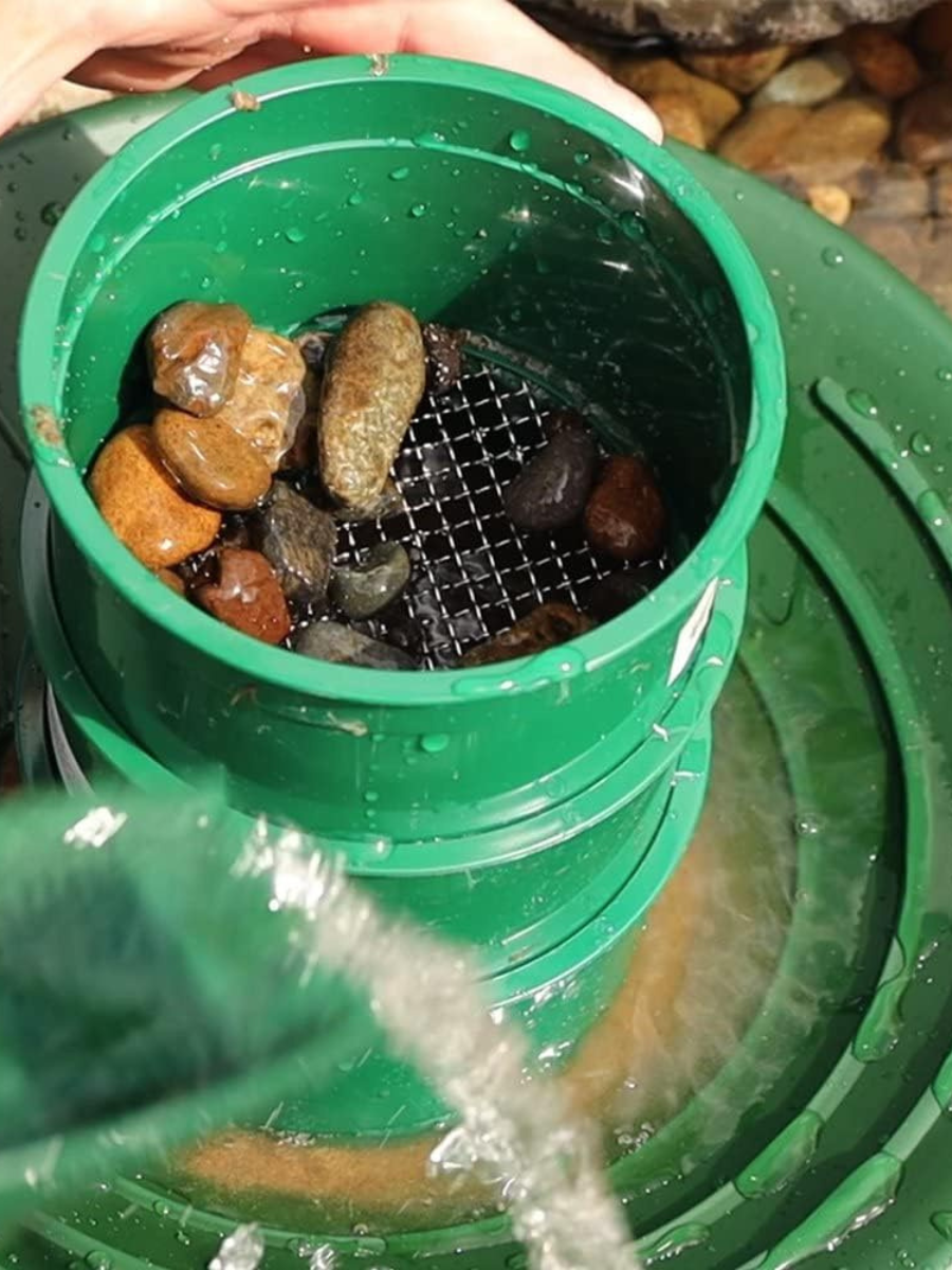 green mini classifier screens with rocks in them on top of large single riffle gold pan