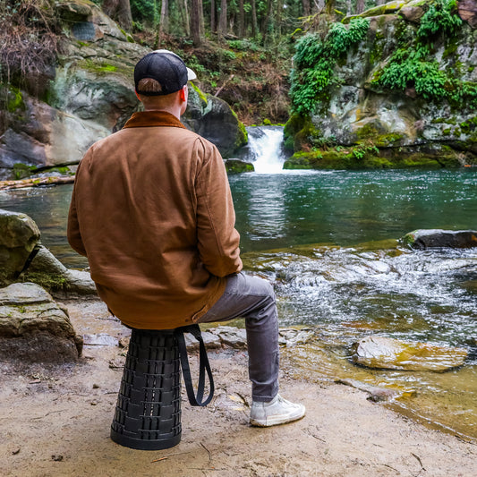 Collapsible Stool outdoors by a river or waterfall scenic view