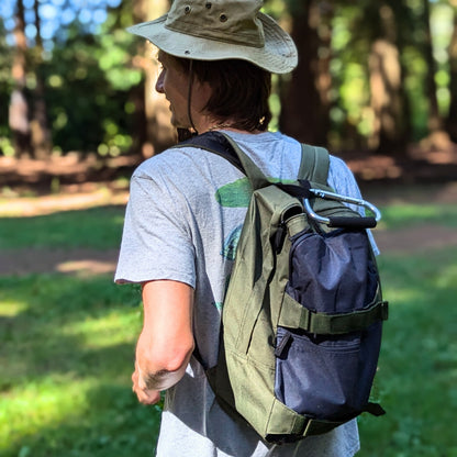 19L everyday backpack with a griptape front and padded shoulder straps in green and blue (view 2).