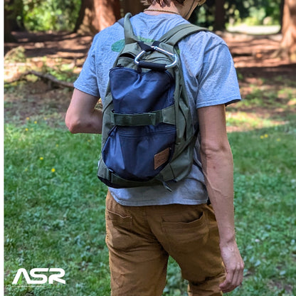 19L everyday backpack with a griptape front and padded shoulder straps in green and blue (view 3).