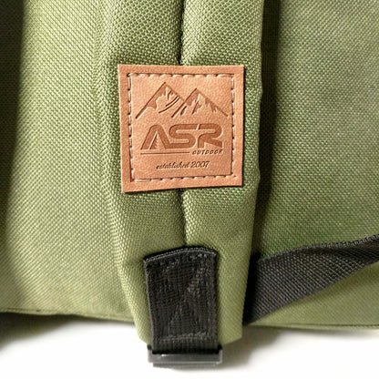 19L everyday backpack with a griptape front and padded shoulder straps in green and blue (view 7).