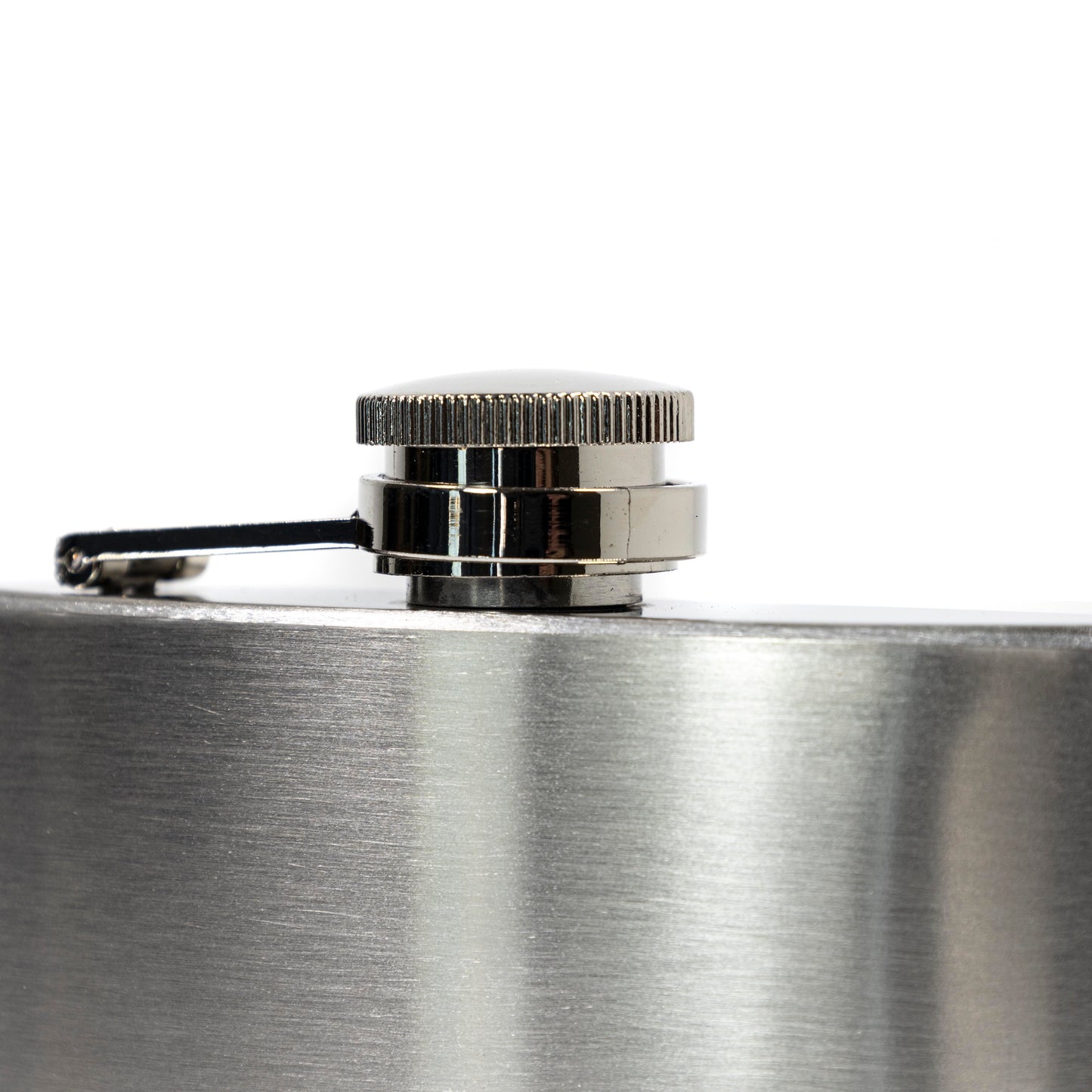 Close-up of a silver flask with a cap on a white background
