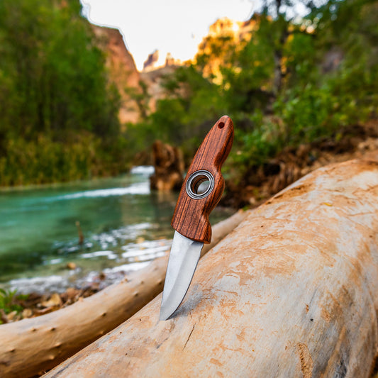 spin knife fixed blade tricks ball bearing scenic view by river