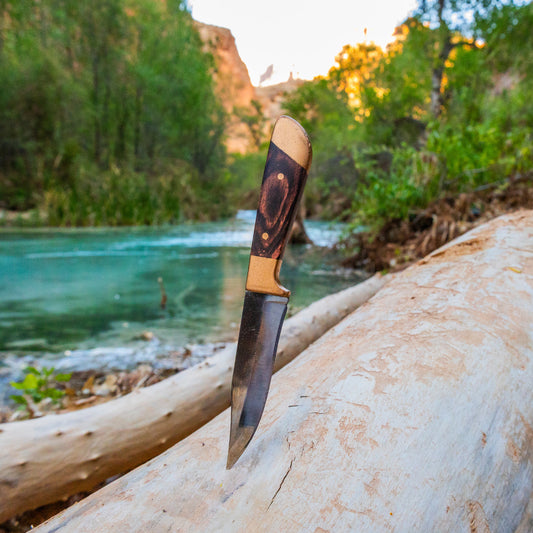 mini huntsman knife scenic view blue river in the desert